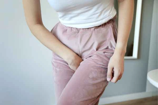 woman running for the toilet because of urinary incontinence Derbyshire